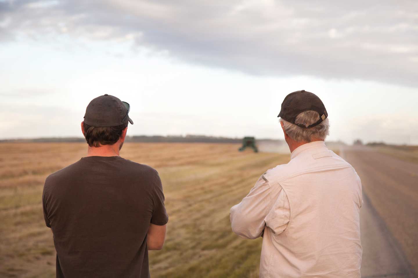 Farmers observing work being done on farmland